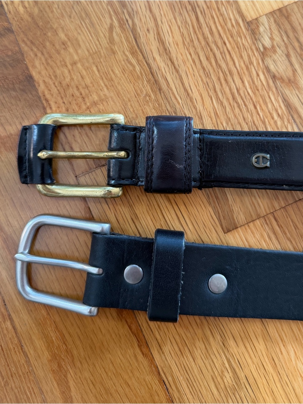 Black genuine leather Belts by Etienne Aigner and Los Angeles Apparel
